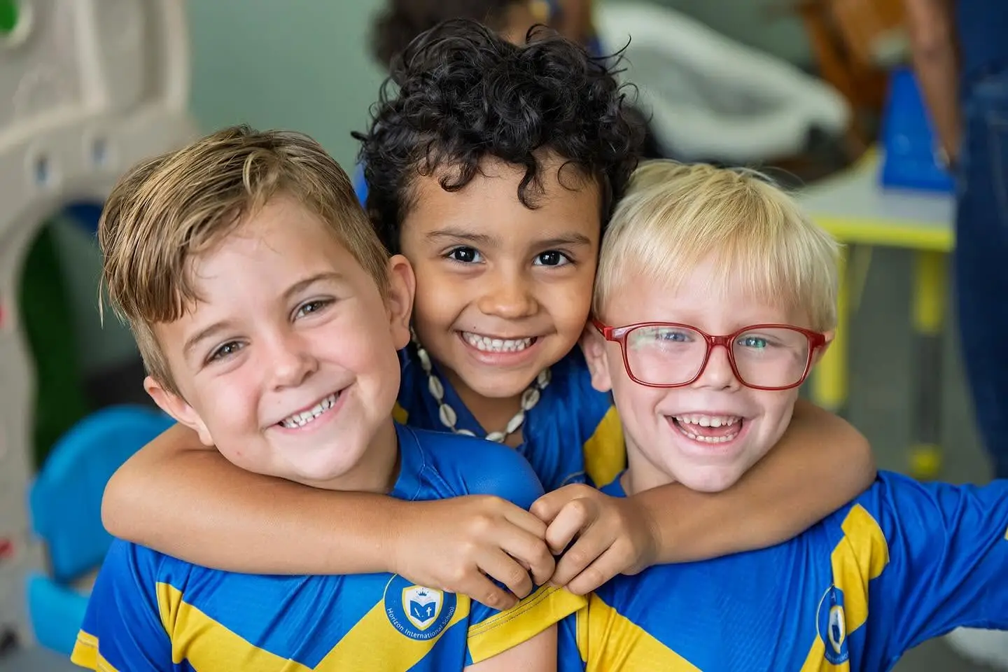 Three HIS students smiling together