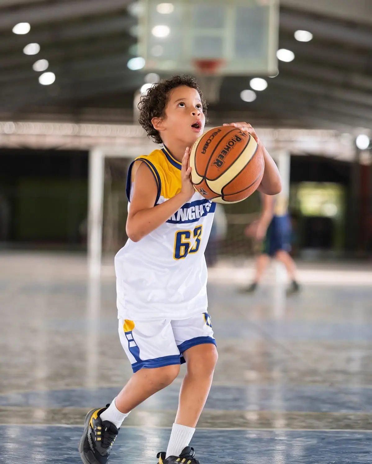 Student playing basketball